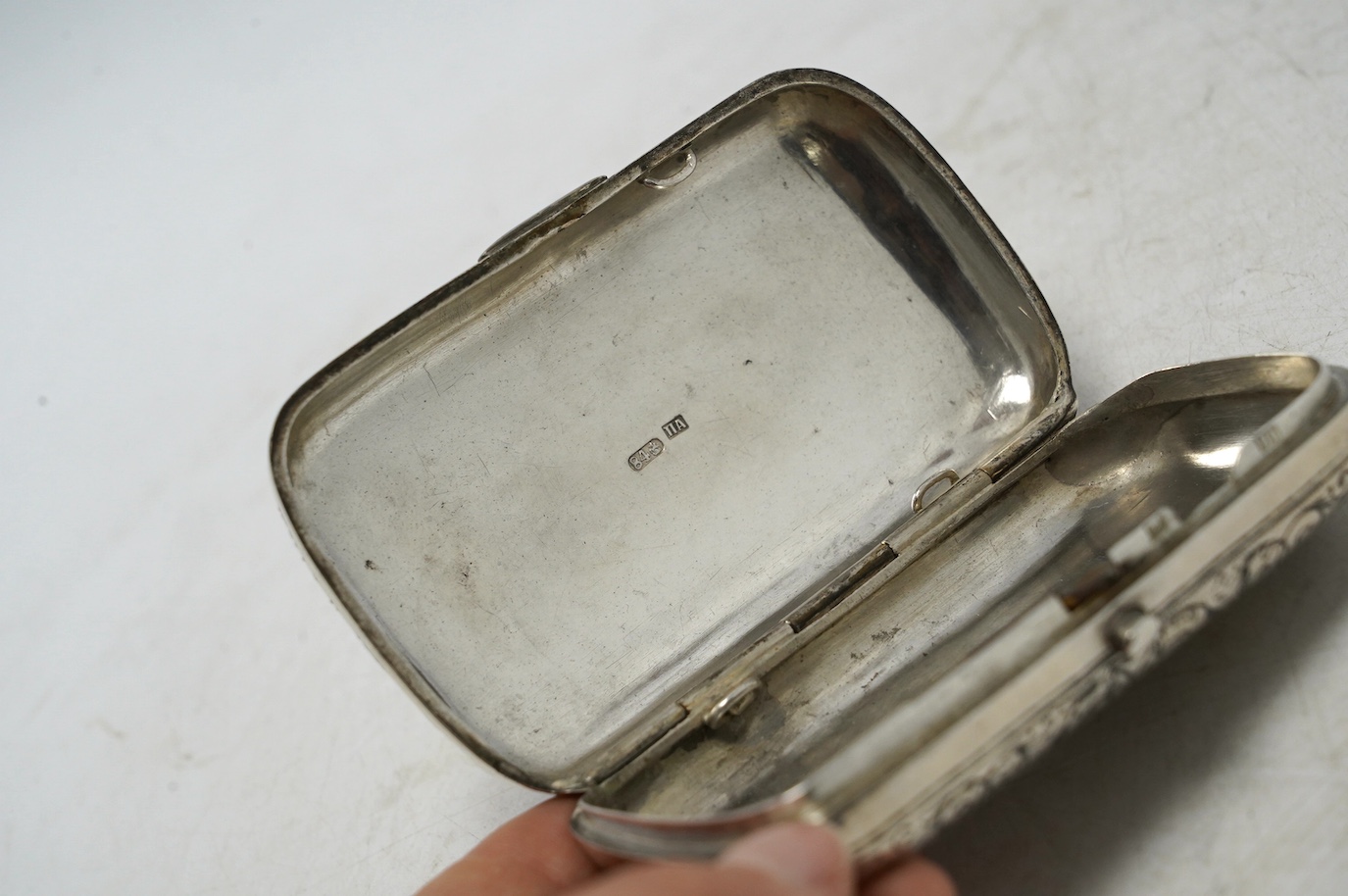 A late 19th century Russian 84 zolotnik and niello ovoid snuff box, Moscow, 1879, 96mm, gross 104 grams. Condition - poor to fair